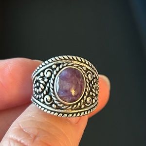 Silver ring with purple stone